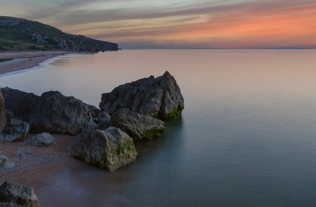 quiet evening landscape with rock in seaの写真素材