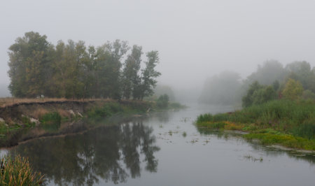 Morning landscape with a foggy riverの写真素材
