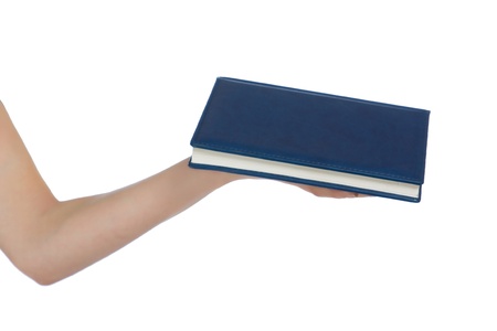 A hand with a blue book on a white backgroundの写真素材