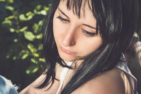 Portrait of beautiful sadyoung sad woman outdoorsの写真素材