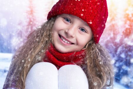 Winter. Portrait of a happy child. Beautiful little girlの写真素材