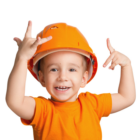 Child in the construction helmet on a white backgroundの写真素材