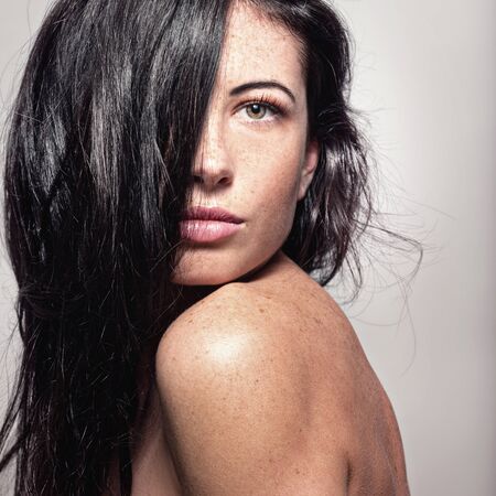 Portrait of a beautiful young woman with beautiful long hairの写真素材