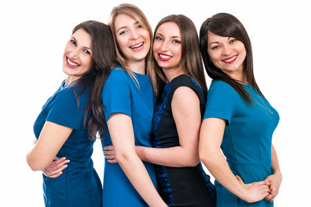 Portrait of four beautiful women on a white backgroundの写真素材