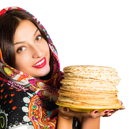 Portrait of a beautiful cheerful young woman with pancakes