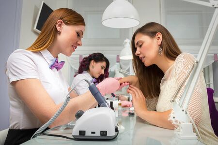 Manicurist at work in the beauty salon. Hand careの写真素材