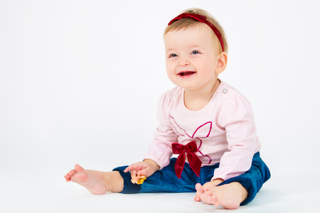 Portrait of a beautiful little girl. Child on a white backgroundの写真素材