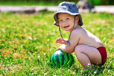 Portrait of a beautiful little boy in the summer outdoorsの写真素材
