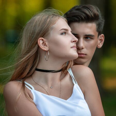 Portrait of a beautiful young couple in love. Teenagers Man and woman outdoorsの写真素材