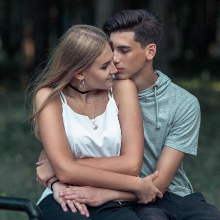 Portrait of a beautiful young couple in love. Teenagers Man and woman outdoorsの写真素材