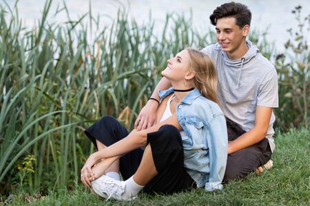 Portrait of a beautiful young couple in love. Teenagers Man and woman outdoorsの写真素材