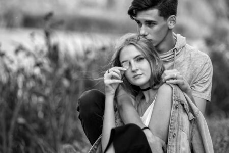 Portrait of a beautiful young couple in love. Teenagers Man and woman outdoorsの写真素材