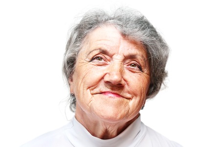 Gracious senior lady portrait on white backgroundの写真素材