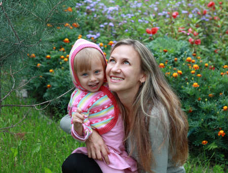Happy Mom and daughter in the garden の写真素材