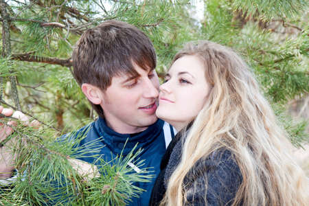 Closeup portrait of a beautiful young couple smiling togetherの写真素材