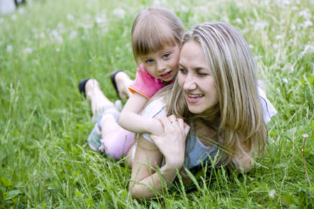  mother and her daughter in the park on a sunny  dayの写真素材