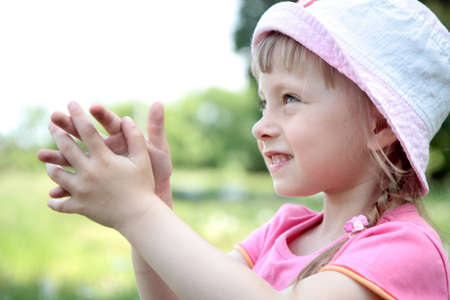 portrait of laughing little girl outdoorの写真素材