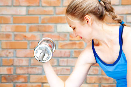 A young woman in sport wear exercising in sport clubの写真素材