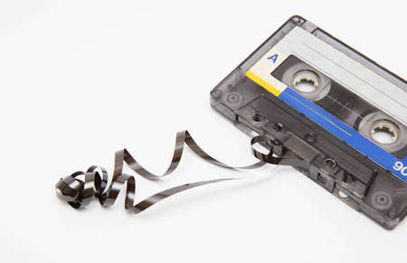 close up of vintage audio tape on white backgroundの写真素材