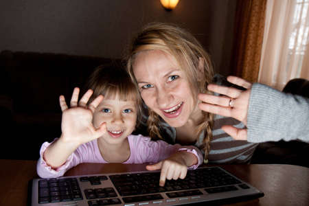Mother and daughter talking in the Internet at homeのeditorial素材