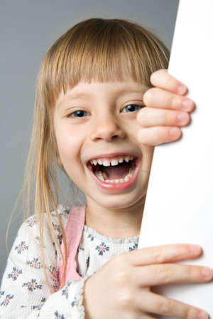 A studio portrait of a girl laughingの写真素材