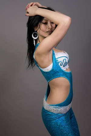 The beautiful girl is dancing in studioの写真素材