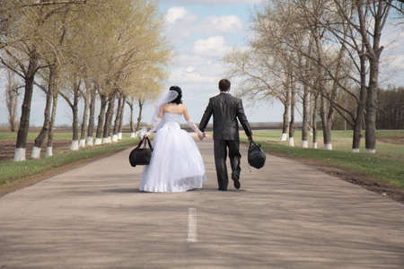 The bride and groom go on the roadの写真素材