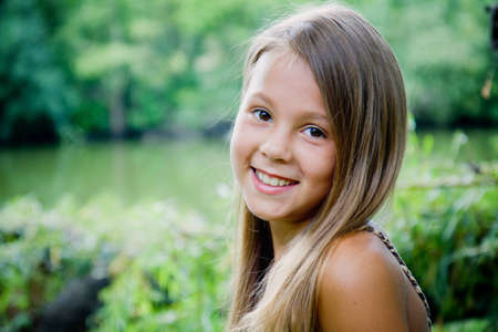 Portrait of smiling girl outdoorsの写真素材