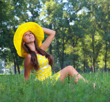 The girl in a hat on natureの写真素材