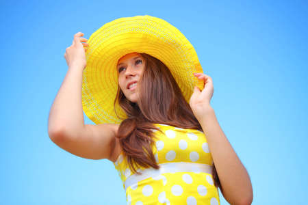 Girl in the hat in the skyの写真素材
