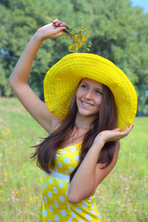 The girl in a hat on natureの写真素材