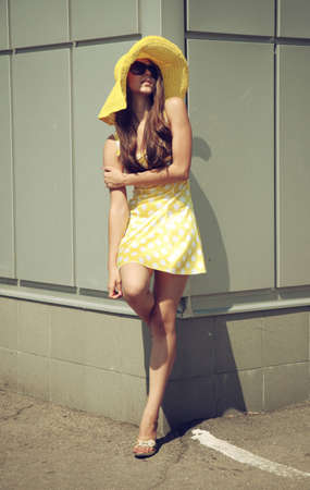 Beautiful girl in a yellow hatの写真素材