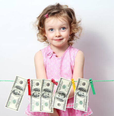 Funny little girl with moneyの写真素材