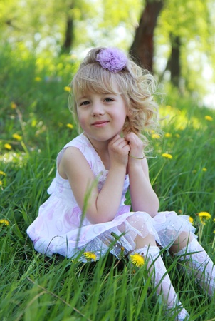 A little girl on the grass.の写真素材