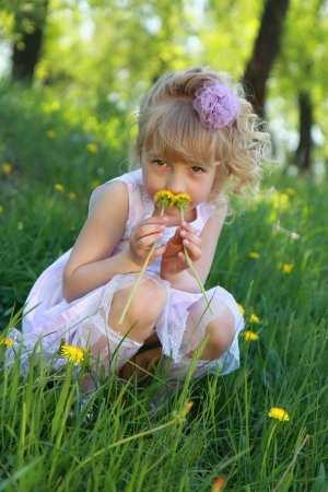 A little girl on the grass.の写真素材
