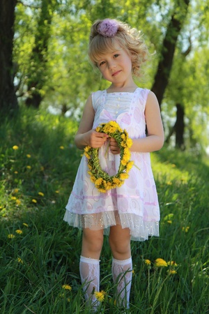 A little girl on the grass.の写真素材