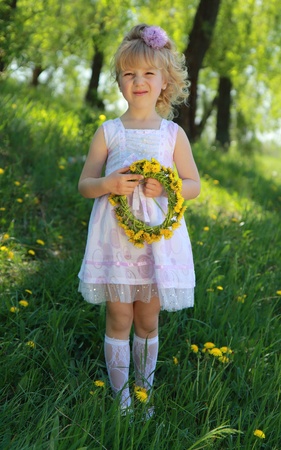 A little girl on the grass.の写真素材