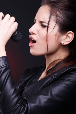 Young girl with microphoneの写真素材