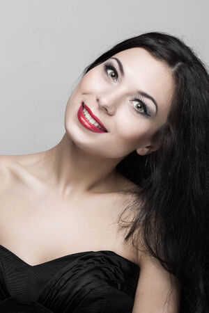 Beautiful woman with curly hair in studio.の写真素材