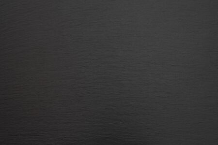 Black Slate Texture, Black stone background. Dark gray grunge banner. Mountain texture. Close-up. Volumetric. The rocky backdrop. Abstract black rock background. top view, Horizontalの写真素材