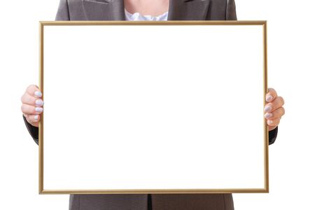 Woman holding a blank poster with golden frame. Holding frame mockup. Isolated on a white background