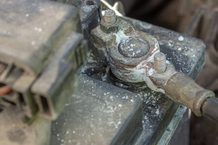 oxidized and dirty car battery terminal. A corroded car battery terminal, with blue colored...