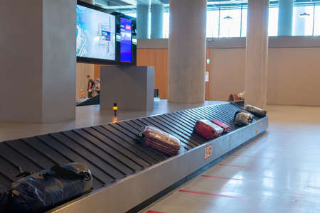 Dalaman, Turkey - October 11 2020: YDA Dalaman Havalimani airport. Suitcase or luggage with conveyor...