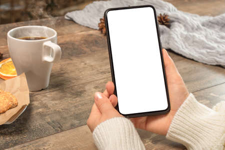 mockup phone. cellphone Mockup image blank white screen. woman hand holding texting using mobile on...