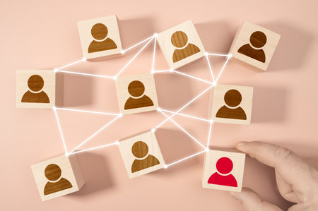 Building a strong team, Wooden blocks with employee icon on pastel background, Human resources and...