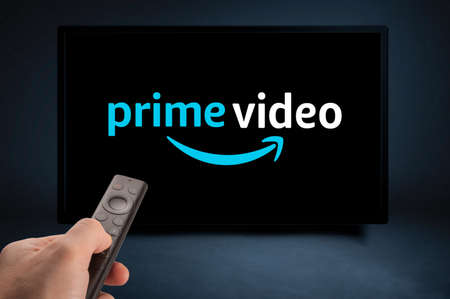 USA, NEW YORK February 2, 2021: Nvidia Sheild TV Remote in Hand and TV Screen with Amazon Prime Video Logo, Amazon Prime Video is a well known global provider of streaming movies and TV seriesのeditorial素材