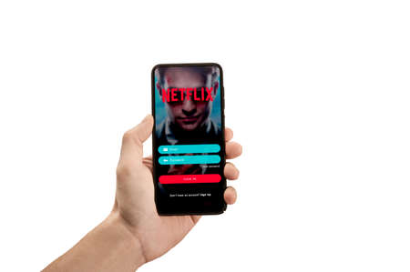 USA, NEW YORK February 2, 2021: Close up of phone with NETFLIX Interface of video distribution service in Hand. Netflix is a well known global provider of streaming moviesのeditorial素材