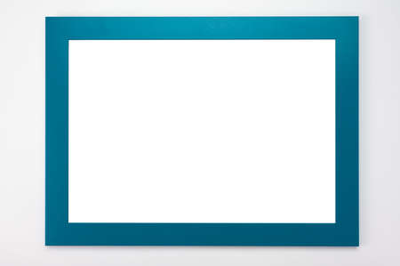 Horizontal Frame Mockup. Isolated on white background. White poster with cyan frame mockup. Man hands hold blue frame. hanging frame mockup on white wall. Picture border mockup.の写真素材