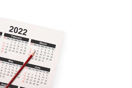 Dates on calendar page 2022 background with pencil. 2022 calendar with pencil on white background...