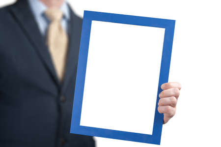 Mockup image. businessman holds the empty white board. man wearing business shirt holding blank...